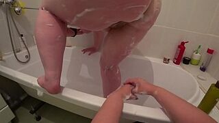 Lesbian fucks mature milf in the bathroom, a bottle in a hairy pussy and appetizing big ass shakes, juicy butt trembles, POV.